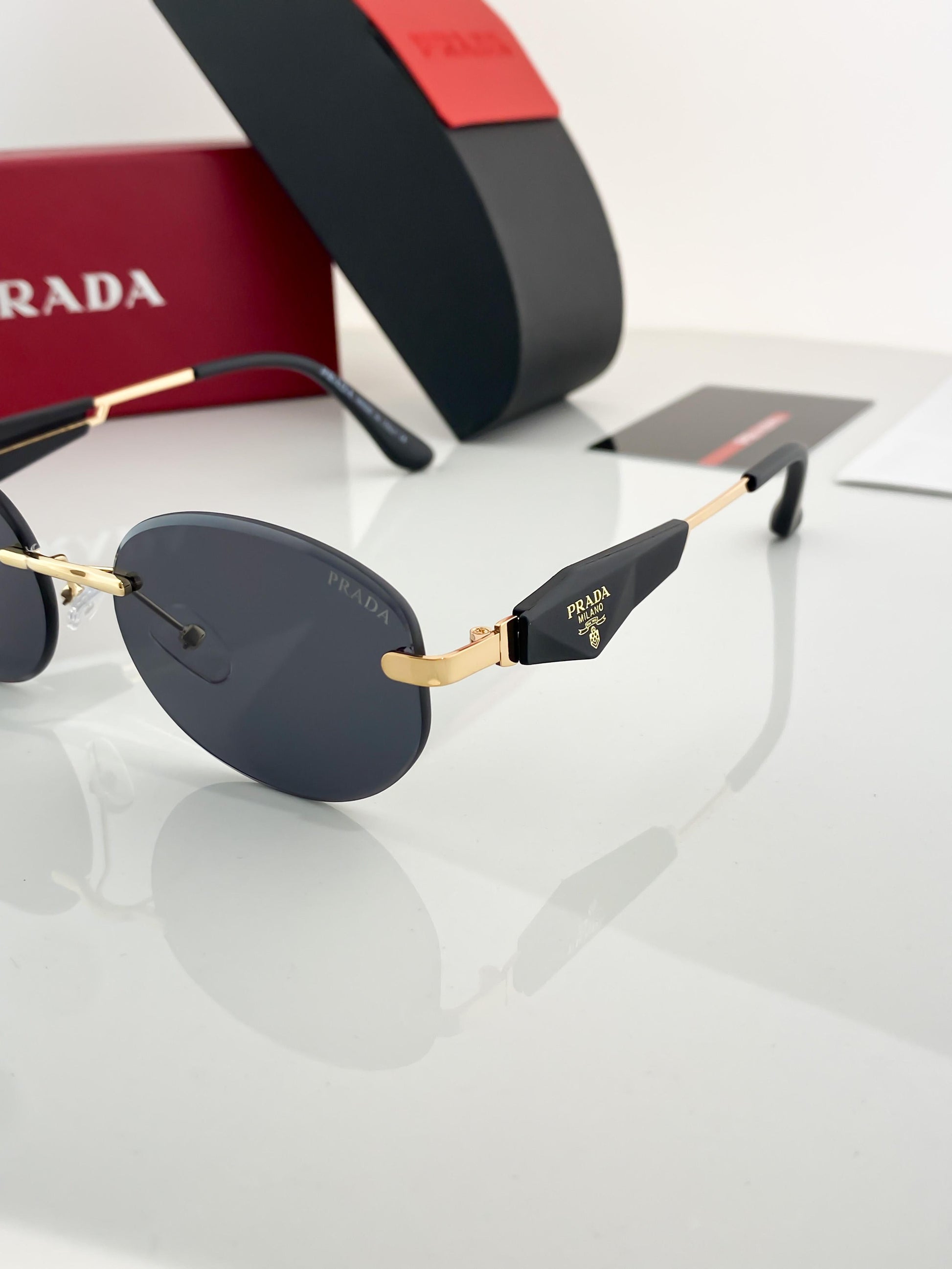 Prada gold black sunglasses with original box and kit
