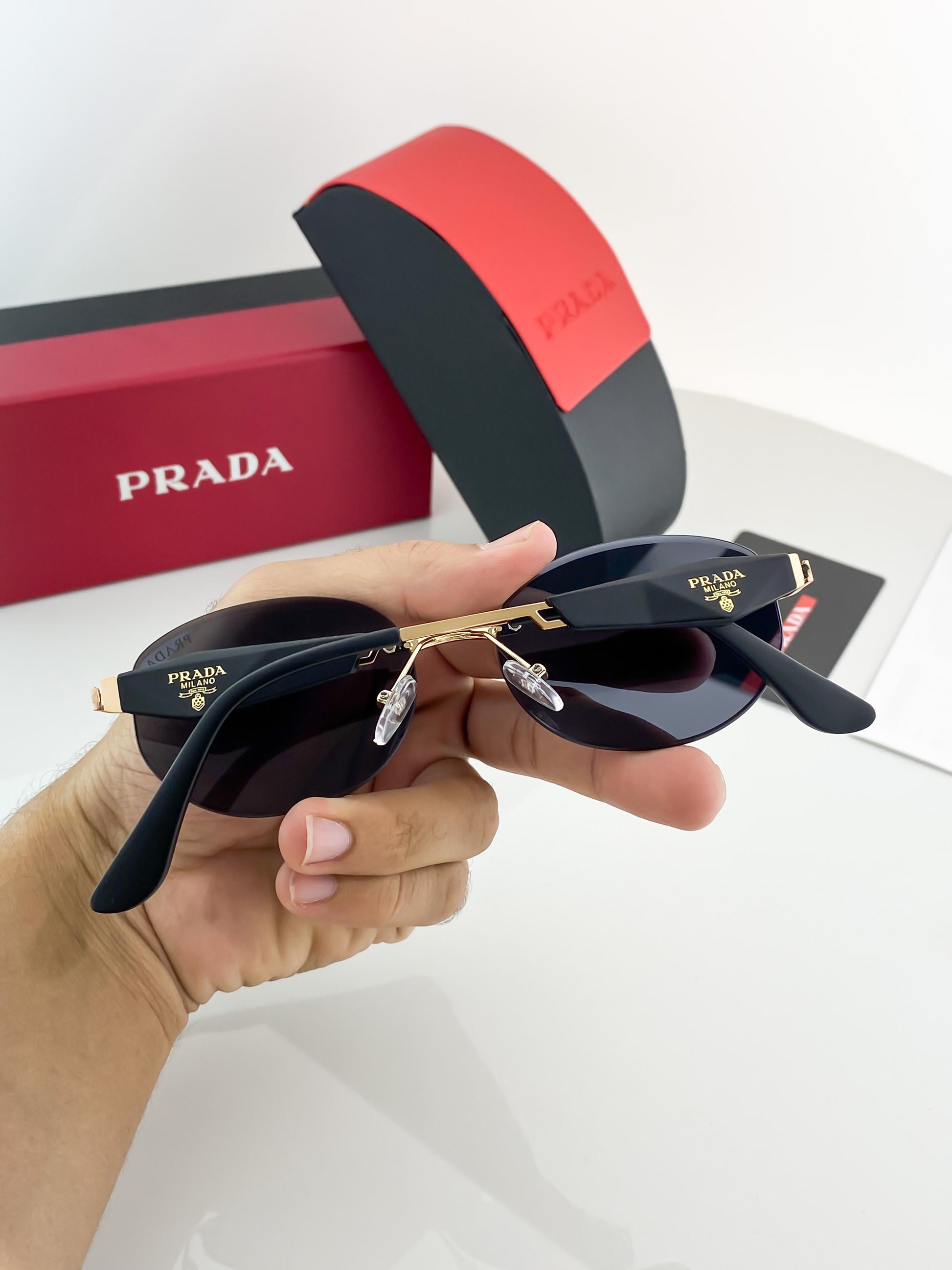 Prada gold black sunglasses with original box and kit