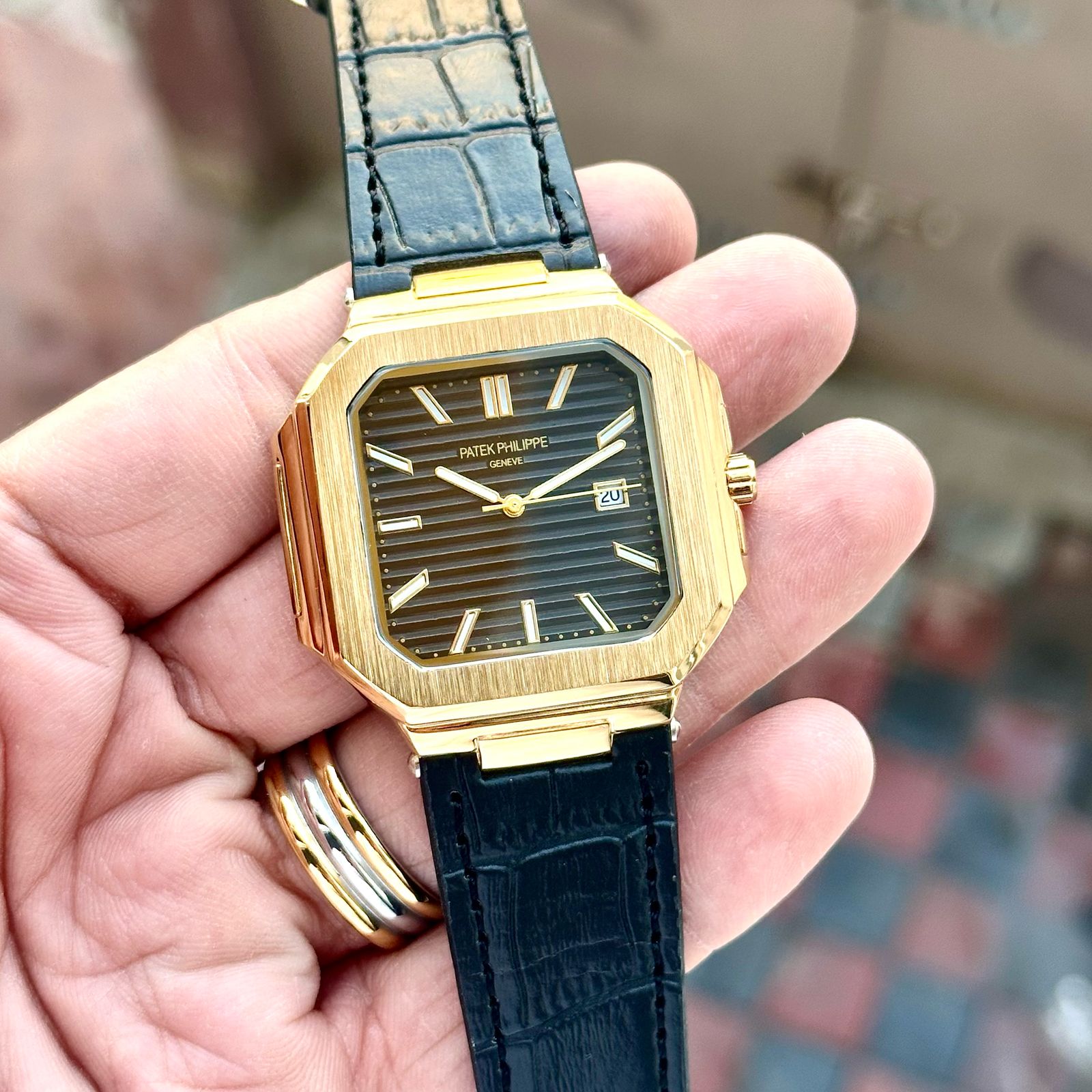 PATEK PHILIPPE slim watch with leather belt