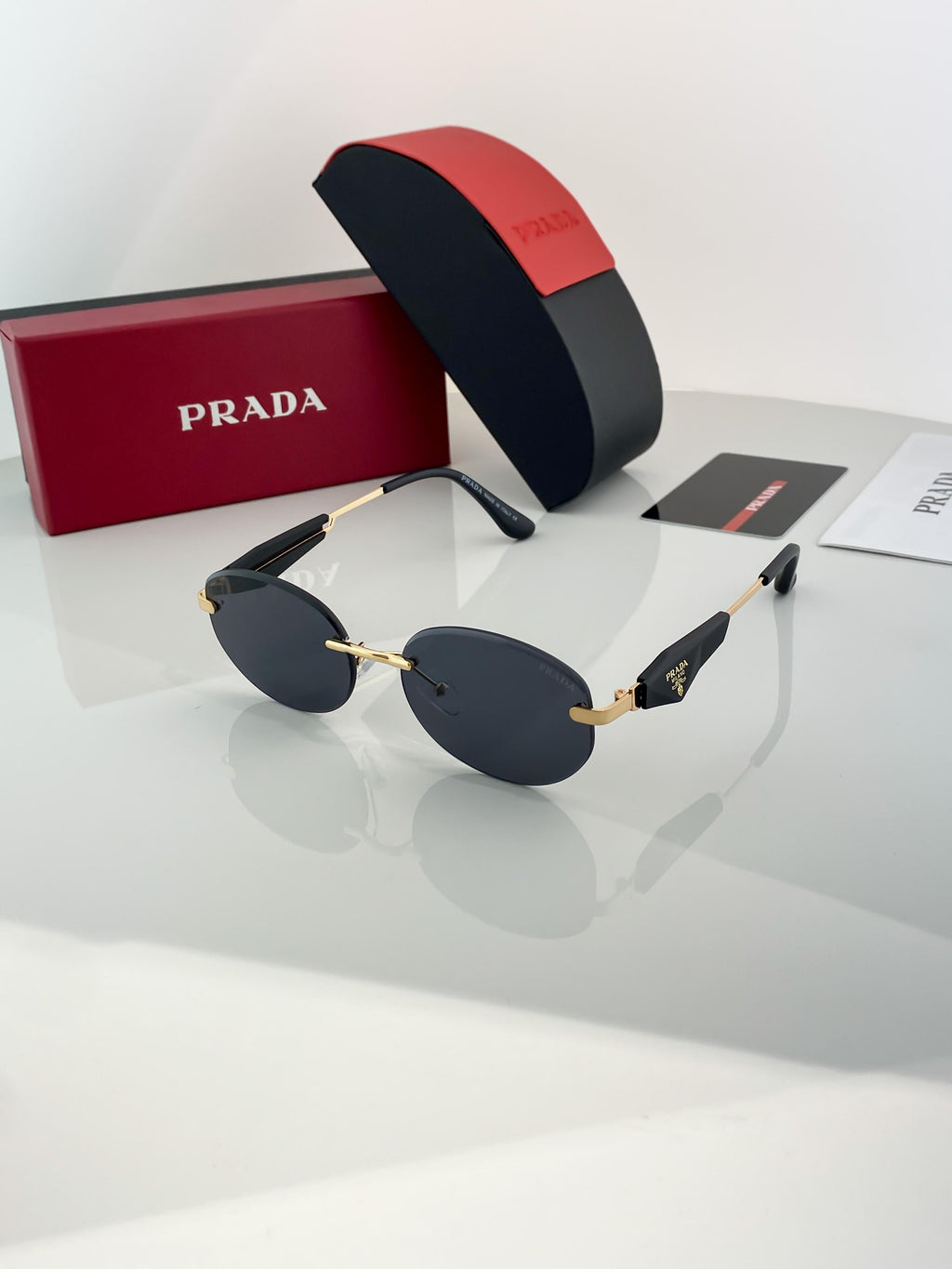 Prada gold black sunglasses with original box and kit